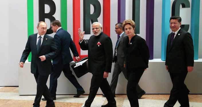 From left in front row: Russian President Vladimir Putin, Indian Prime Minister Narendra Modi, Brazilian President Dilma Rousseff, Chinese President Xi Jinping walk for a plenary session during the summit in Ufa, Russia, Thursday, July 9, 2015 From left in front row: Russian President Vladimir Putin, Indian Prime Minister Narendra Modi, Brazilian President Dilma Rousseff, Chinese President Xi Jinping walk for a plenary session during the summit in Ufa, Russia, Thursday, July 9, 2015